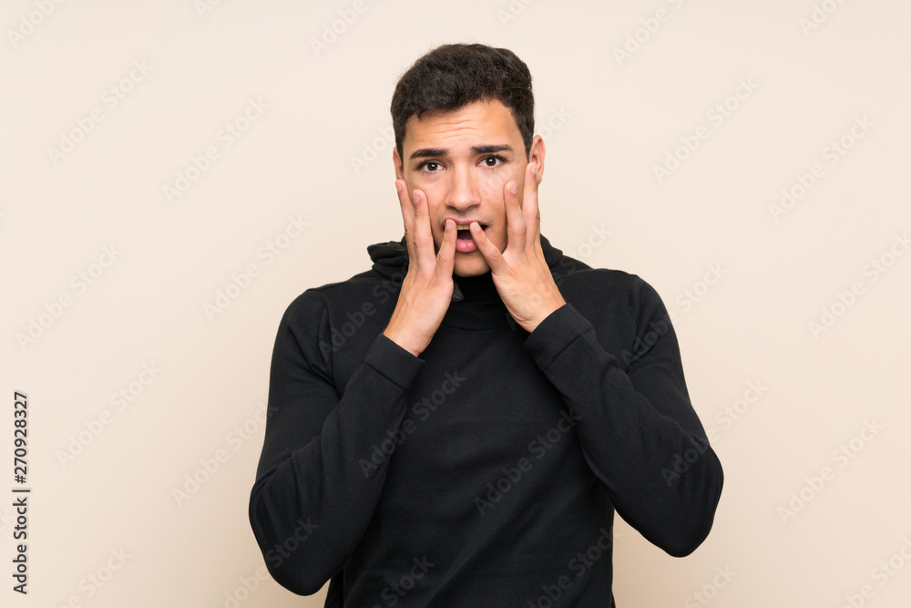 Handsome man over isolated background with surprise facial expression Handsome man over isolated background with surprise facial expression