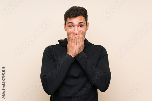 Handsome man over isolated background with surprise facial expression