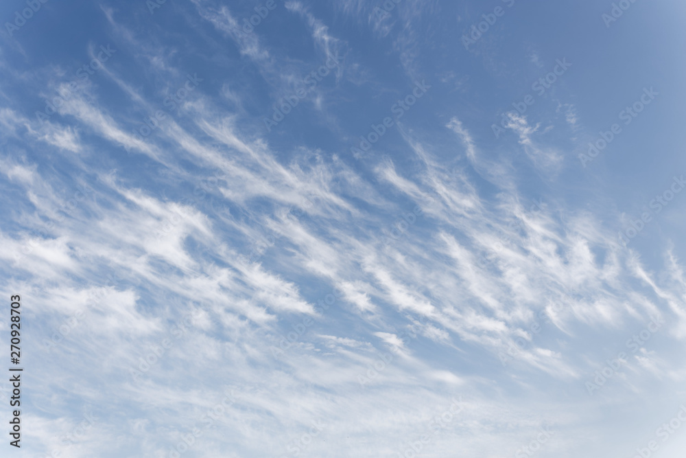 Beautiful cirrus clouds. Blue sky with beautiful clouds. Sky background
