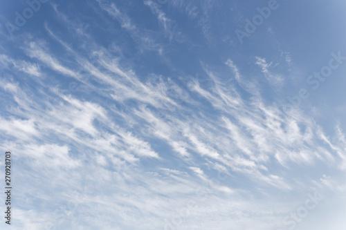 Beautiful cirrus clouds. Blue sky with beautiful clouds. Sky background