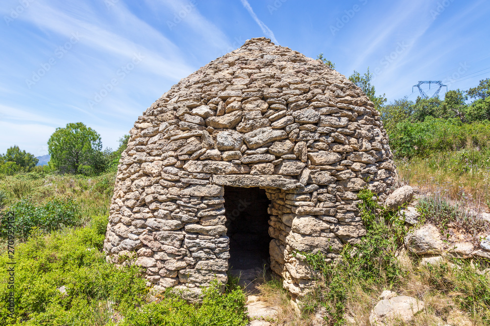 Salon, France. 05-30-2019- Old stone building called Borie, at the Tallagard mountain near Salon de Provence France.