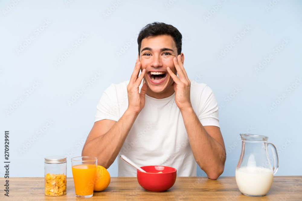 Handsome man in having breakfast with surprise facial expression Handsome man in having breakfast with surprise facial expression
