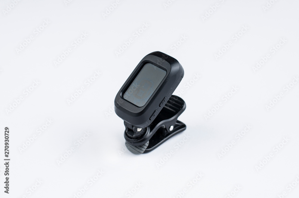Tuner for guitar isolated on white background.Copy space Tuner for guitar isolated on white background.Copy space