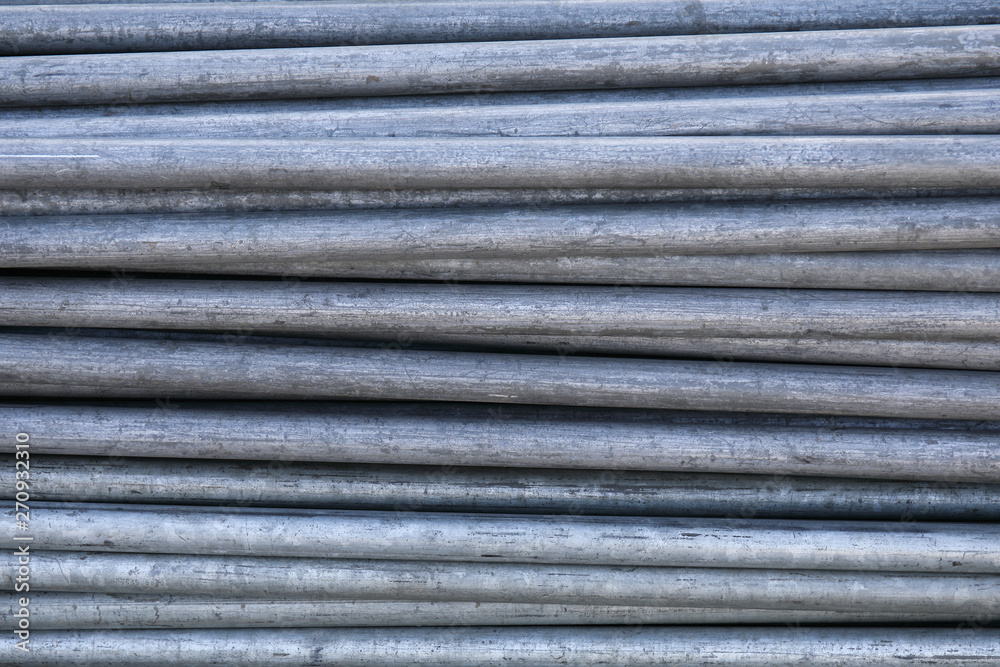 Rows of steel bar storage and stacking in the warehouse for industrial construction. Rows of steel bar storage and stacking in the warehouse for industrial construction.