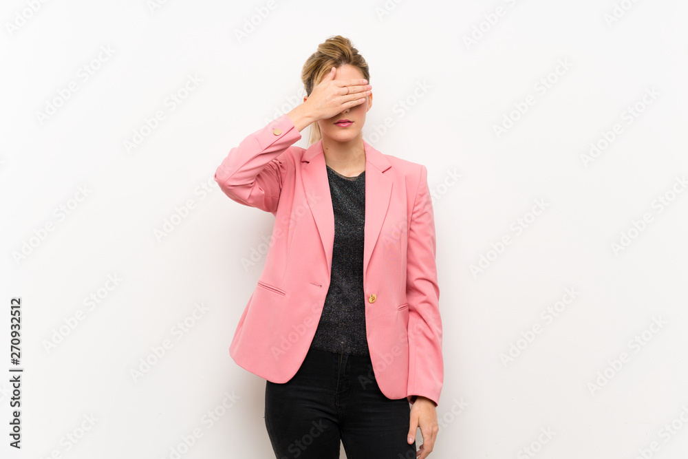 Young blonde woman with pink suit covering eyes by hands. Do not want to see something Young blonde woman with pink suit covering eyes by hands. Do not want to see something