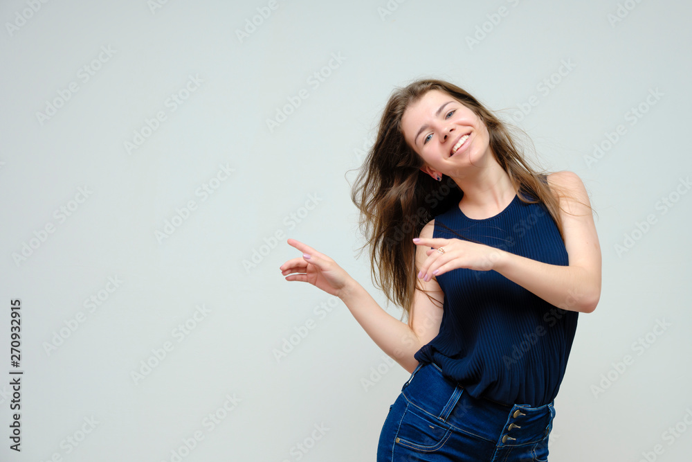 Photo portrait of a beautiful sexy brunette woman girl, smiling and pleased with life, with long flowing dark hair on a white background. Photo portrait of a beautiful sexy brunette woman girl, smiling and pleased with life, with long flowing dark hair on a white background.