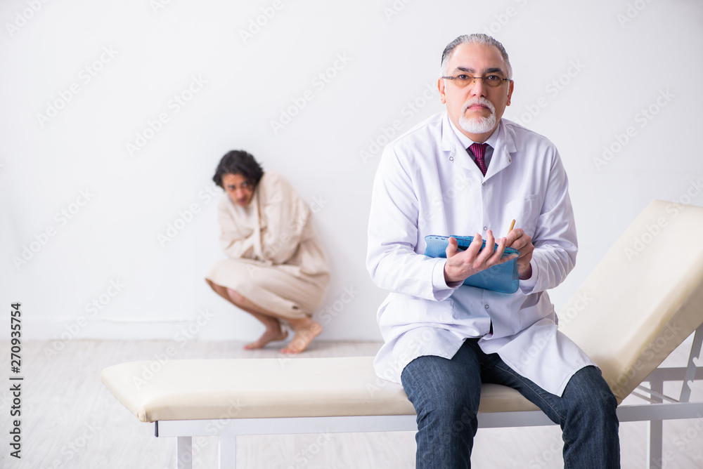 Aged male doctor psychiatrist examining young patient 