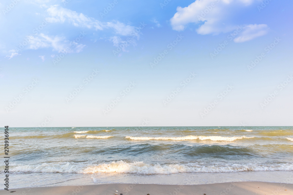 Empty beautiful sand beach with blue sky and cloud background. Tropical sea and summer beach.