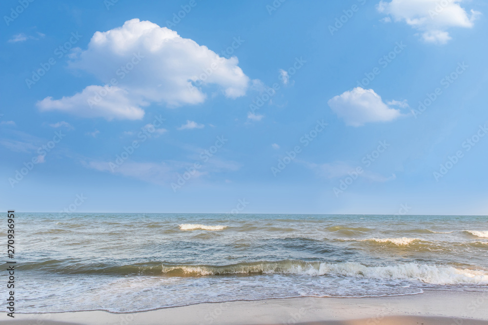 Empty beautiful sand beach with blue sky and cloud background. Tropical sea and summer beach.