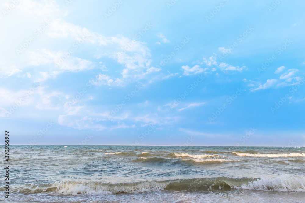 Empty beautiful sand beach with blue sky and cloud background. Tropical sea and summer beach.