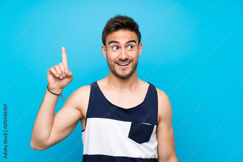 Handsome young man over isolated background intending to realizes the solution while lifting a finger up Handsome young man over isolated background intending to realizes the solution while lifting a finger up