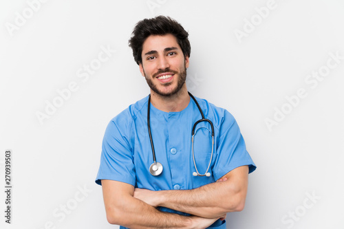 Surgeon doctor man over isolated white wall laughing photo