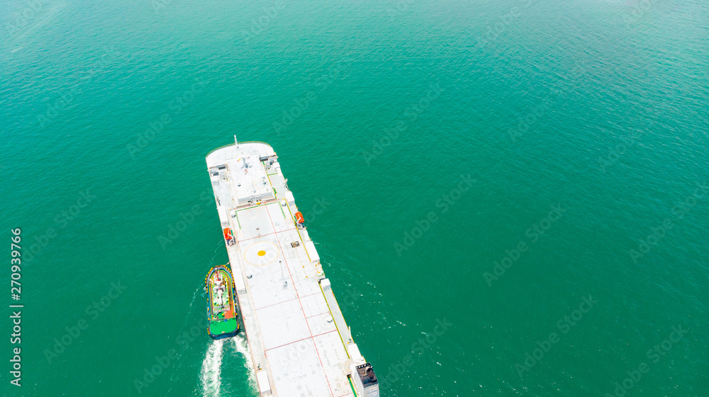 Aerial view cargo ship of business logistic sea freight, New Cars produced by year up in the port for Cargo ship and Cargo import-export around in the world