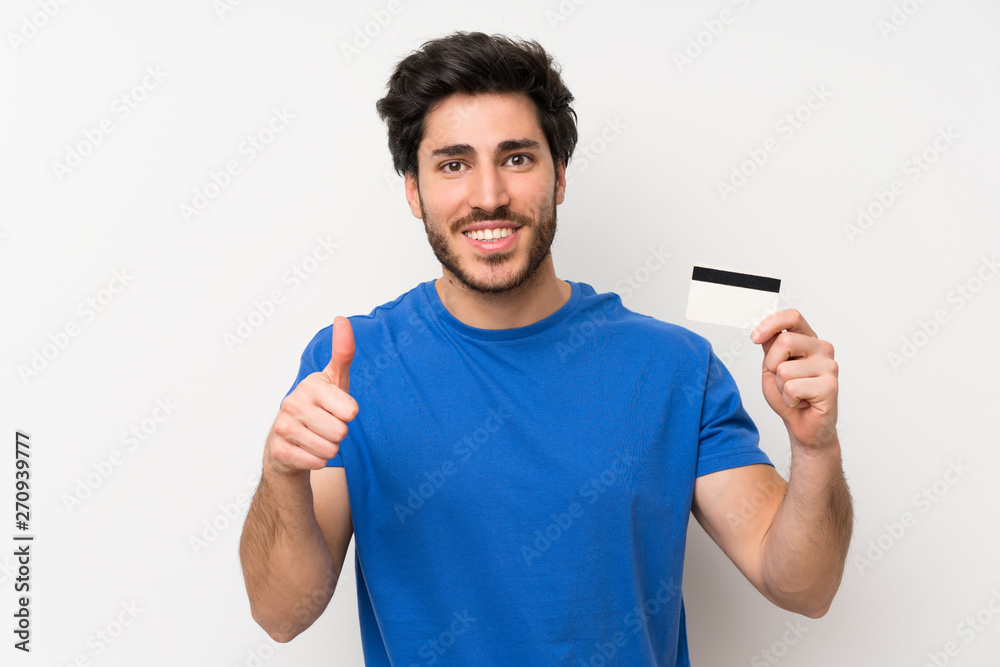 Handsome man holding a credit card Handsome man holding a credit card
