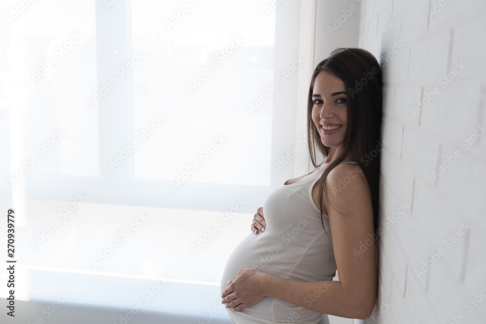 Beautiful young smiling pregnant woman. Happiness Beautiful young smiling pregnant woman. Happiness