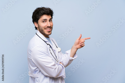 Doctor man pointing finger to the side