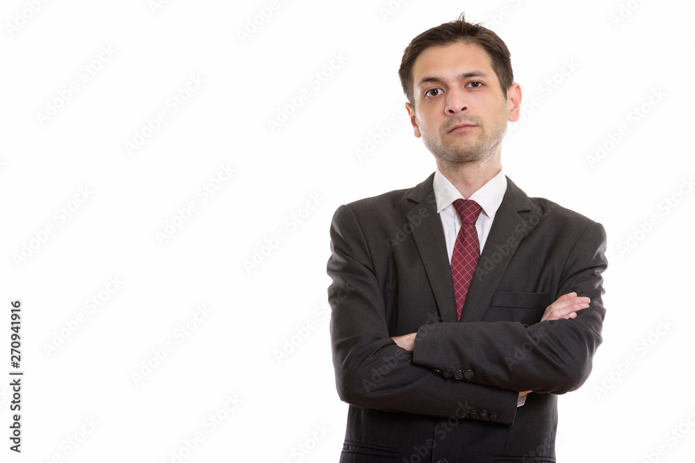 Studio shot of young businessman with arms crossed Studio shot of young businessman with arms crossed