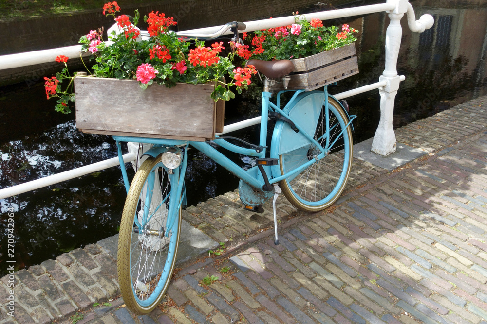 Old-fashioned blue Dutch city bike