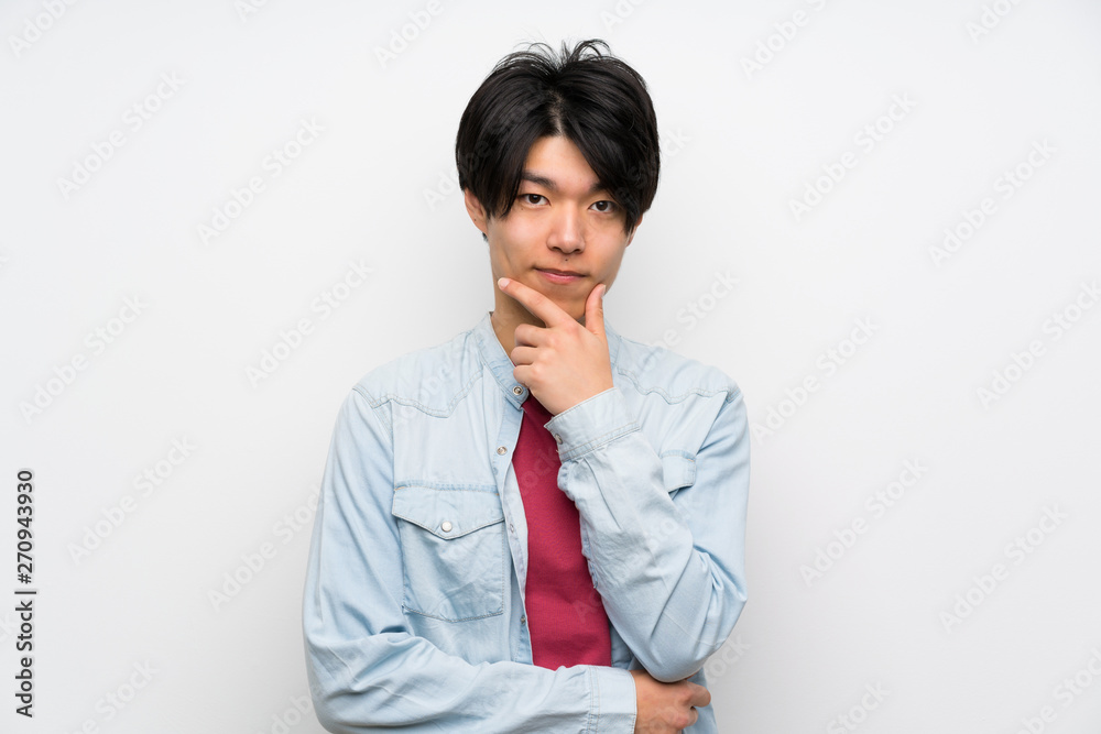 Asian man on isolated white background thinking Asian man on isolated white background thinking
