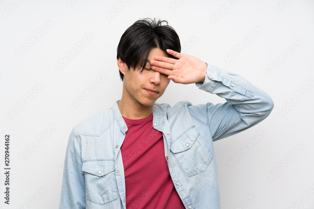 Asian man on isolated white background with tired and sick expression Asian man on isolated white background with tired and sick expression