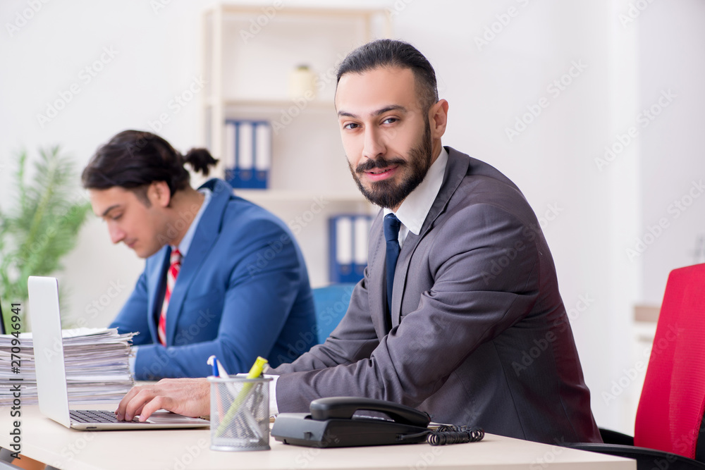 Two male colleagues in the office Two male colleagues in the office