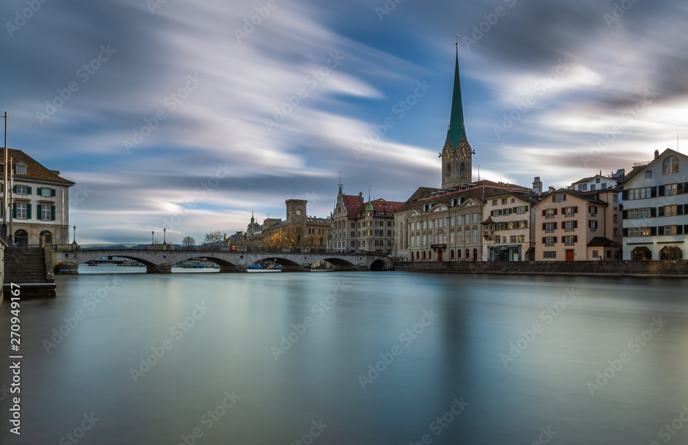 Kirche Fraumünster in Zürich, Switzerland. Panoramic Long exposure view of the historic city center of Zurich with famous Fraumunster Church from the river Limmat , Zurich, Switzerland.