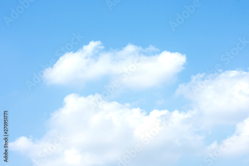 White clouds in the blue sky on a bright day