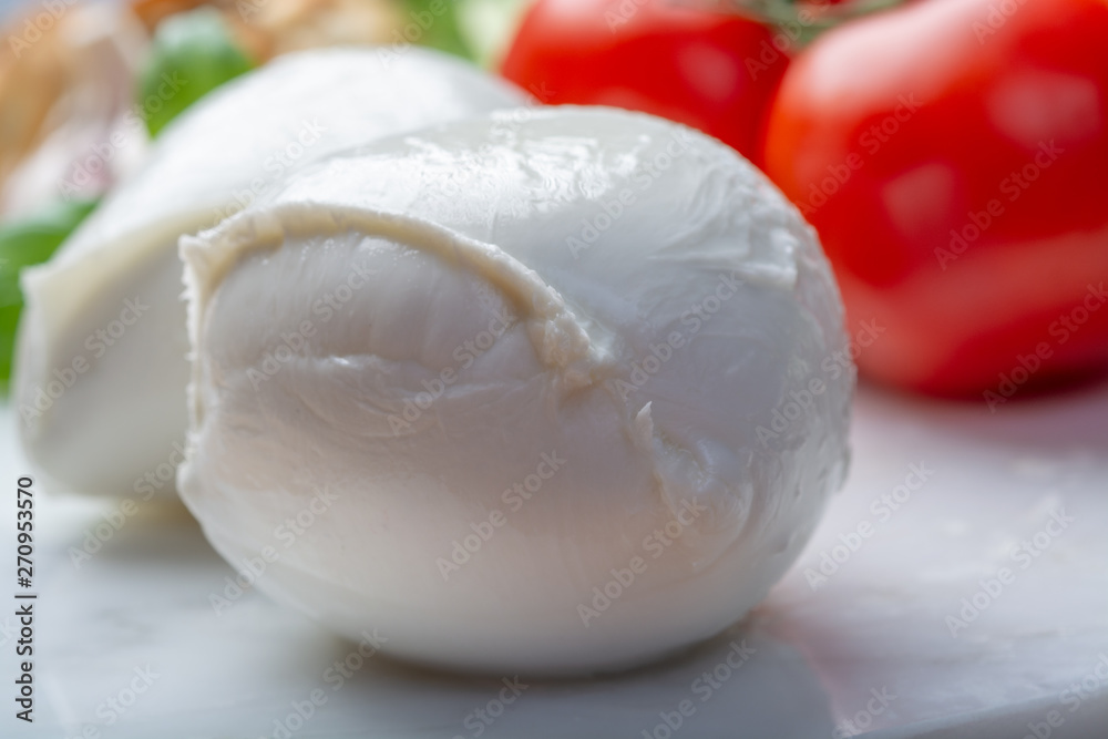 Balls of buffalo mozzarella, soft Italian scheese made from the milk of Italian Mediterranean buffalo Balls of buffalo mozzarella, soft Italian scheese made from the milk of Italian Mediterranean buffalo