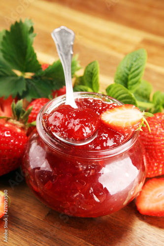 Wallpaper Mural strawberry jam with fresh strawberries and mint. marmalade on spoon and jar on brown wood Torontodigital.ca