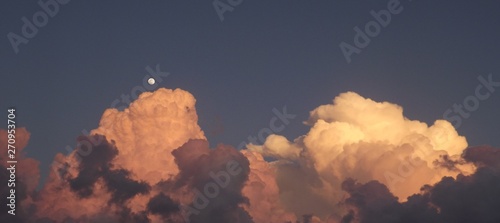 Rising Sunset Clouds with Moon