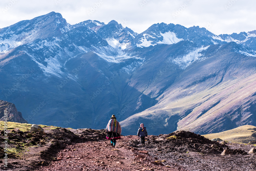 Mother and Child from Behind walking in Andes Mountains of Peru