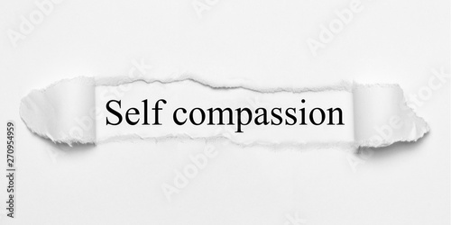 Foto Self compassion on white torn paper