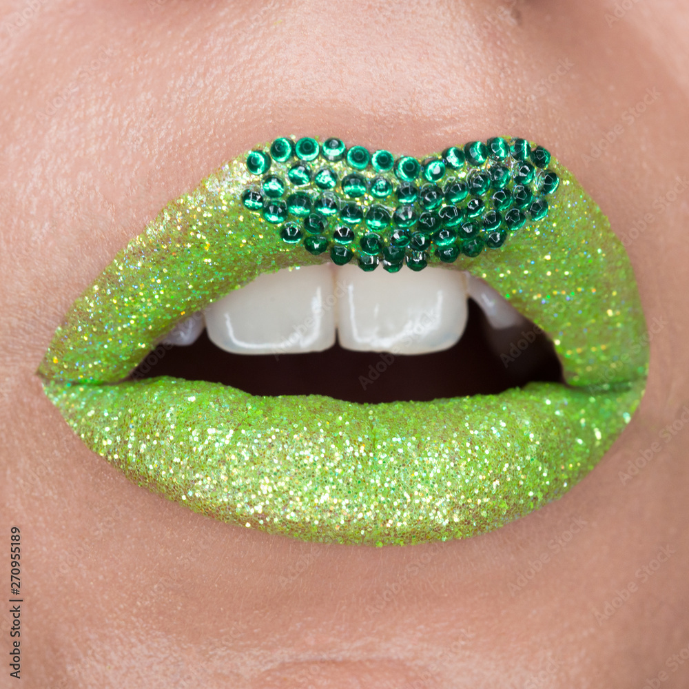 Green lips with sparkles covered with gemstones. Beautiful green ...