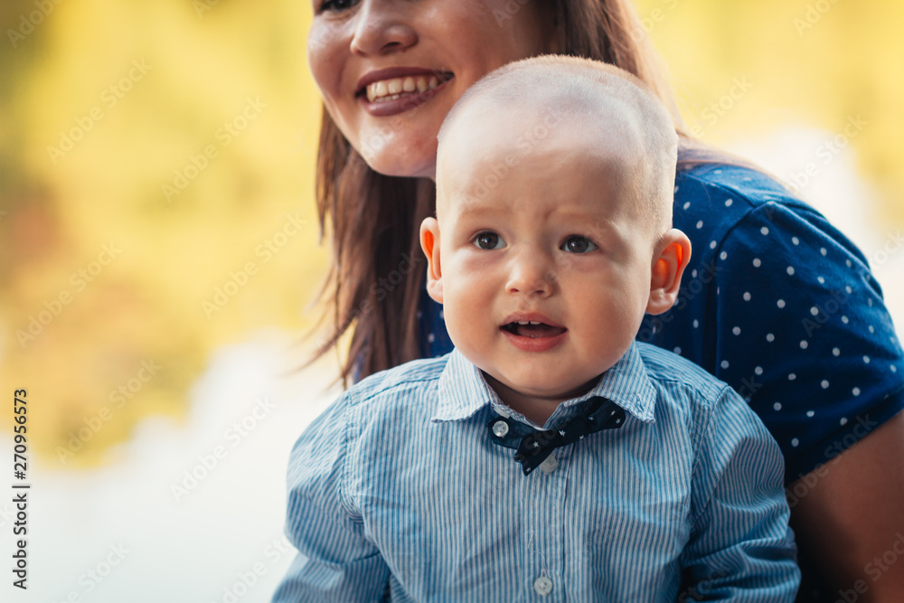 Fototapeta premium happy mother and toddler son on nature background