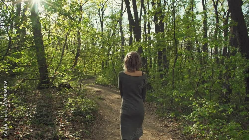 Attractive girl walks through the forest and enjoys in National Park Fruska Gora Attractive girl walks through the forest and enjoys in National Park Fruska Gora