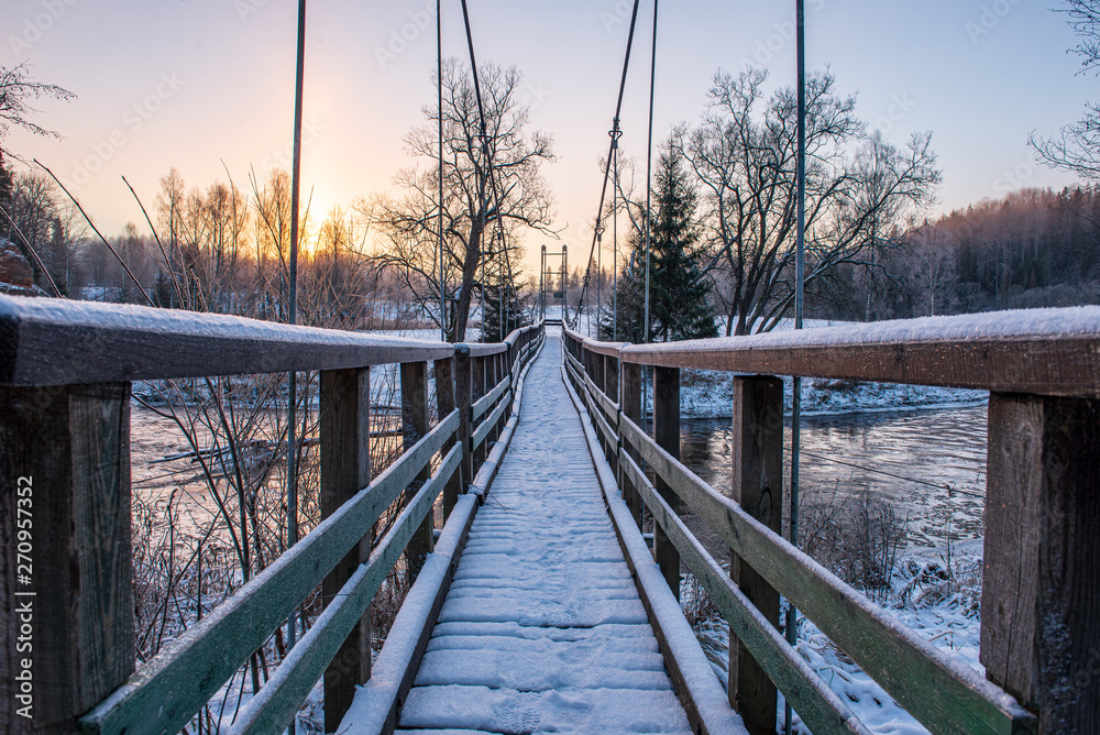 Naklejka premium metal bridge over the river in country