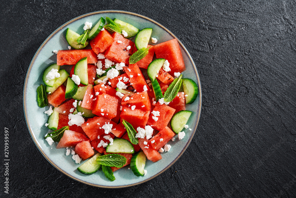 Fotografie Summer salad with watermelon and cucumbers