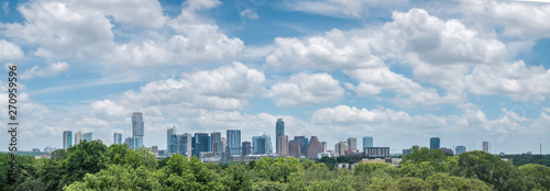 Panoramic View of Austin Texas Downtown Skyline With Bright Sun and Cloudy Skies photo