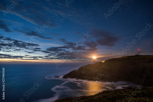 Starry night sky with clouds at Trevose head on Cornwalls North coast, UK © stevie_uk