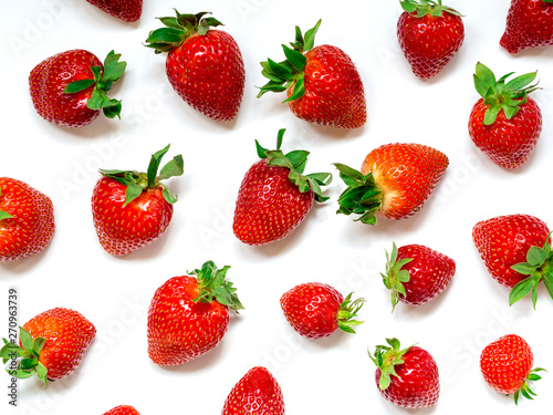 red strawberry on white background as a pattern, background and texture