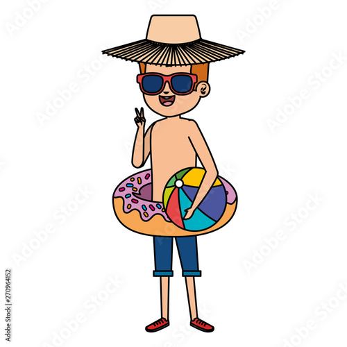 cute little boy with donut float and beach balloon