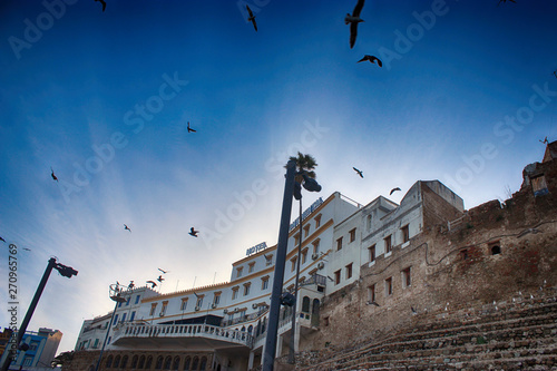 Moroccan mosque with the banner of Morocco. Islamic mosque for prayer. Port of Tangier