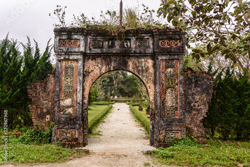 Fotografie, Obraz One of the many old archways in the gardens of Hoàng thành (Imperial City) a walled citadel built in 1804 in Hue, Vietnam