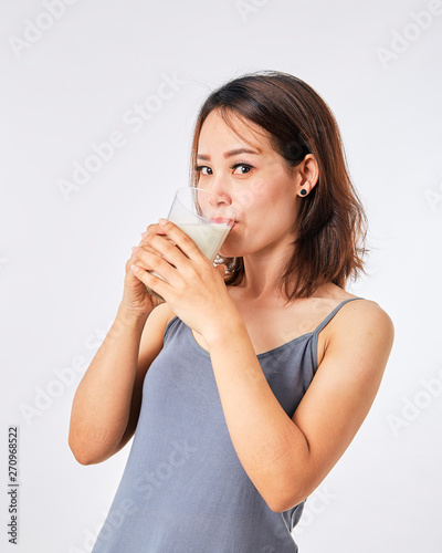 Woman holding a glass of milk