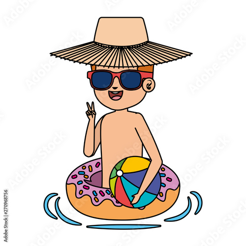 cute little boy with donut float and beach balloon
