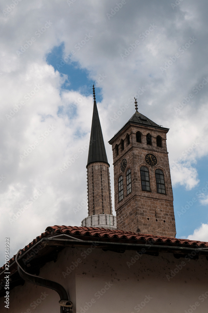 Sarajevo, Bosnia: Sarajevska Sahat Kula, the Clock Tower built by Gazi Husrev-beg, governor in the Ottoman period, and the minaret of Gazi Husrev-beg Mosque (1532) in the Bascarsija neighborhood