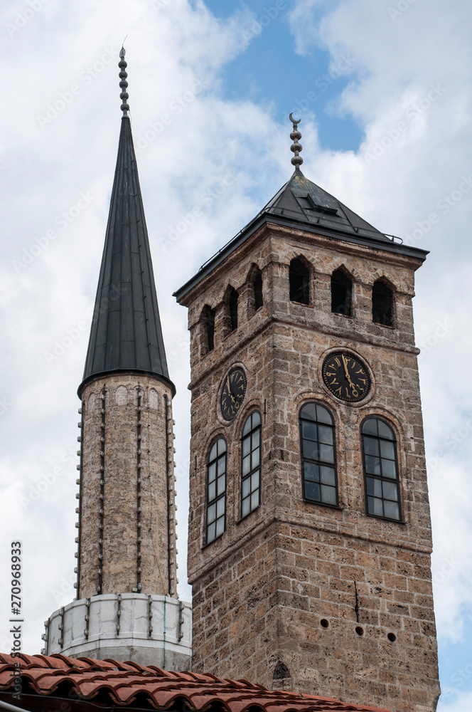 Sarajevo, Bosnia: Sarajevska Sahat Kula, the Clock Tower built by Gazi Husrev-beg, governor in the Ottoman period, and the minaret of Gazi Husrev-beg Mosque (1532) in the Bascarsija neighborhood