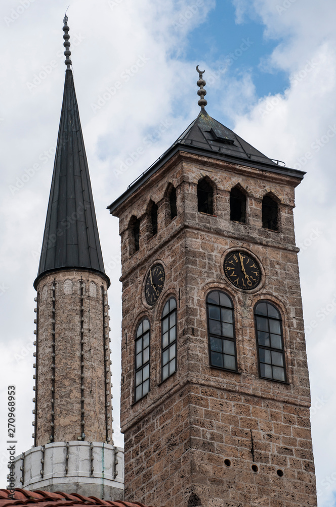 Sarajevo, Bosnia: Sarajevska Sahat Kula, the Clock Tower built by Gazi Husrev-beg, governor in the Ottoman period, and the minaret of Gazi Husrev-beg Mosque (1532) in the Bascarsija neighborhood