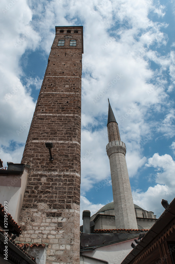 Sarajevo, Bosnia: Sarajevska Sahat Kula, the Clock Tower built by Gazi Husrev-beg, governor in the Ottoman period, and the minaret of Gazi Husrev-beg Mosque (1532) in the Bascarsija neighborhood