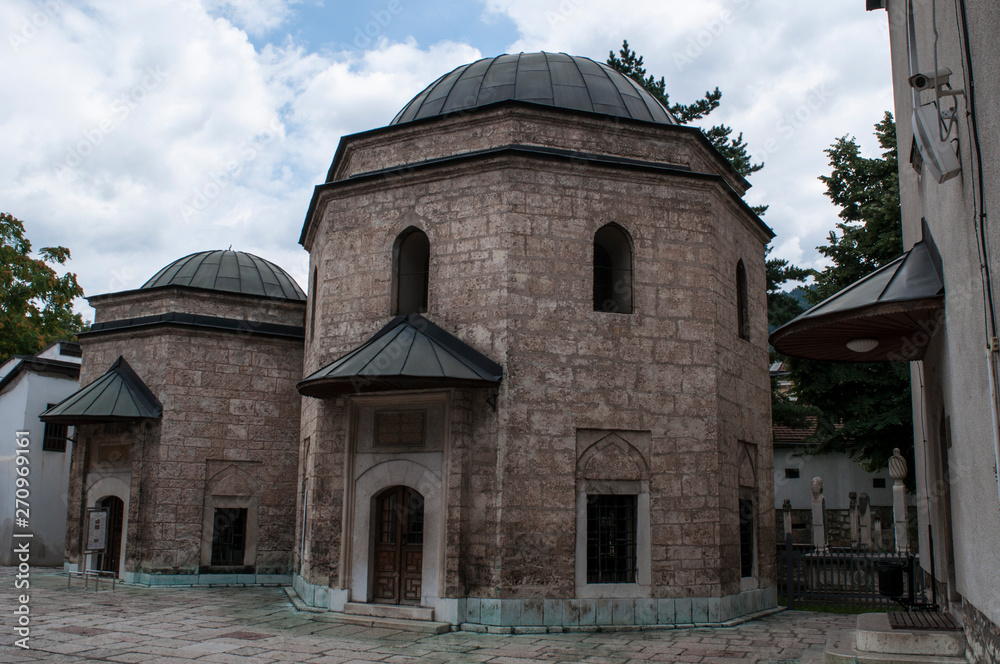 Sarajevo, Bosnia: the two Mausoleums on the eastern side of the Gazi Husrev-beg Mosque (1532), the largest historical mosque in Bosnia, housing the grave of Gazi Husrev Beg and Murat Beg Tardic